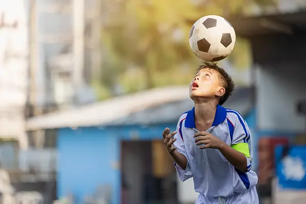 Boy football training skills with soccer ball local thailand